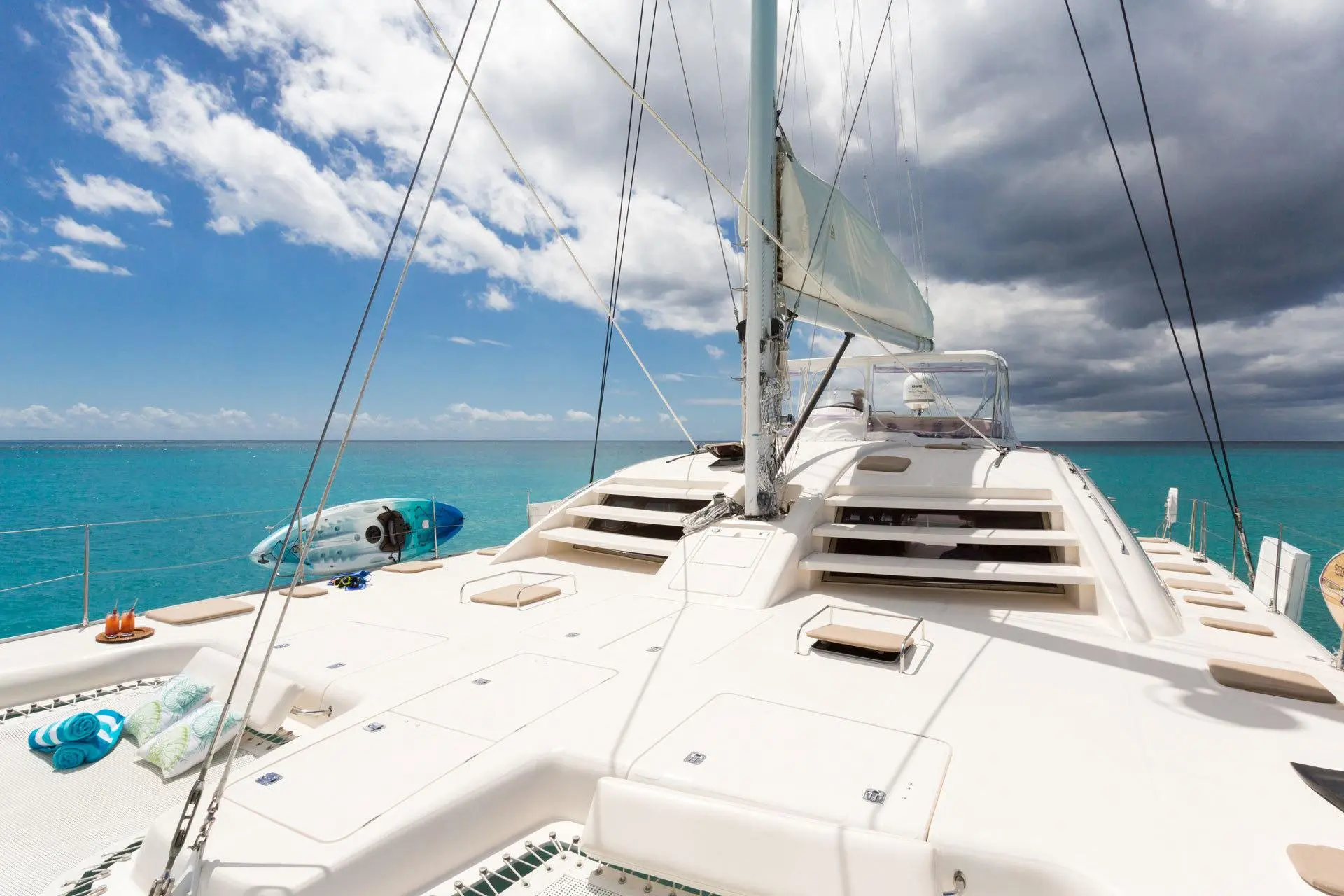 Full deck view under sail with dramatic sky