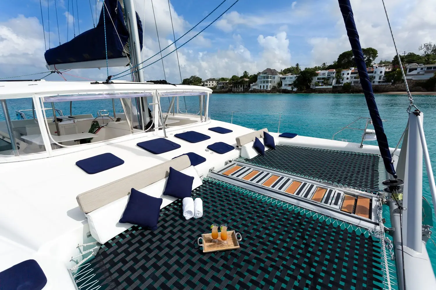 Bow deck with cushions and Barbados coastline